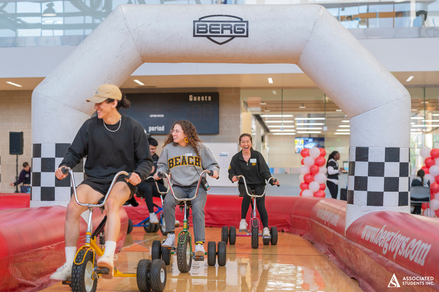 Students riding bikes on obstacle course